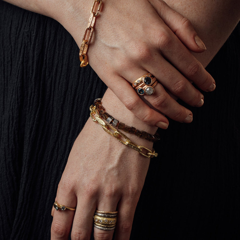 
                      
                        Detail view of model wearing bracelets and rings by Betsy Barron Jewellery.
                      
                    