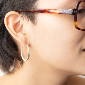 Model wearing Beth Hoop earrings in right ear