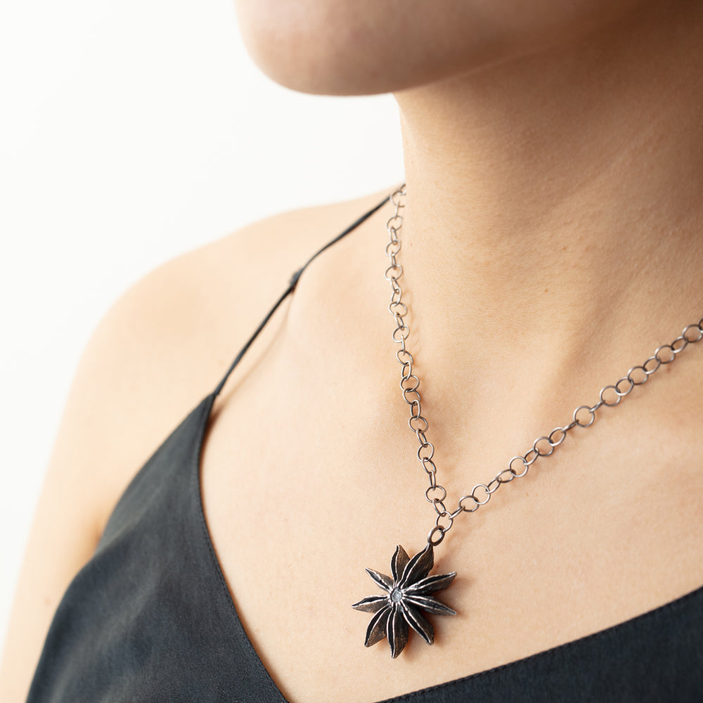 
                      
                        Model wearing Star Anise Necklace
                      
                    