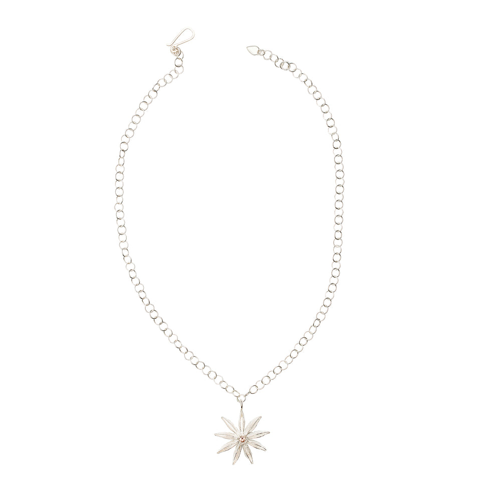 
                      
                        Top-down view of sterling silver Star Anise Necklace with citrine gemstone
                      
                    
