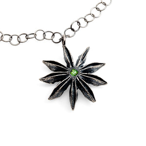 
            
                Load image into Gallery viewer, Detail view of sterling silver Star Anise Necklace with emerald
            
        