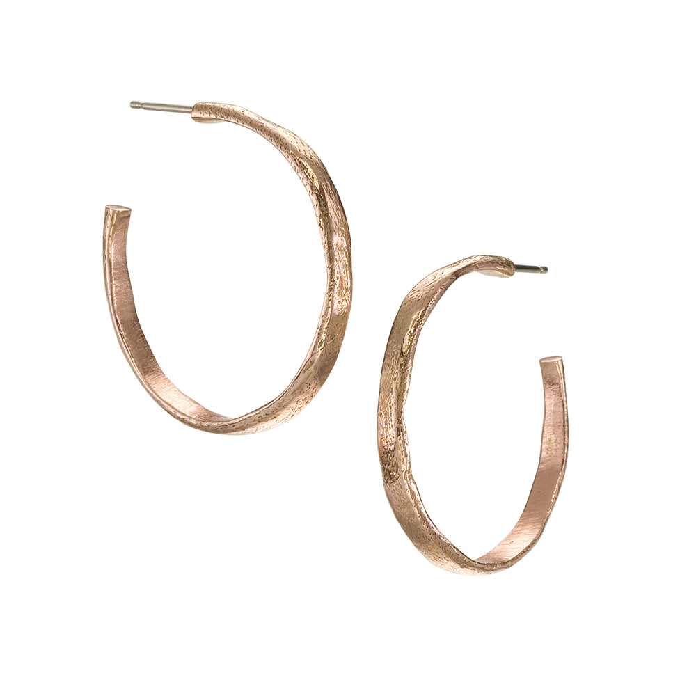 Large molten hoops in 14k rose gold
