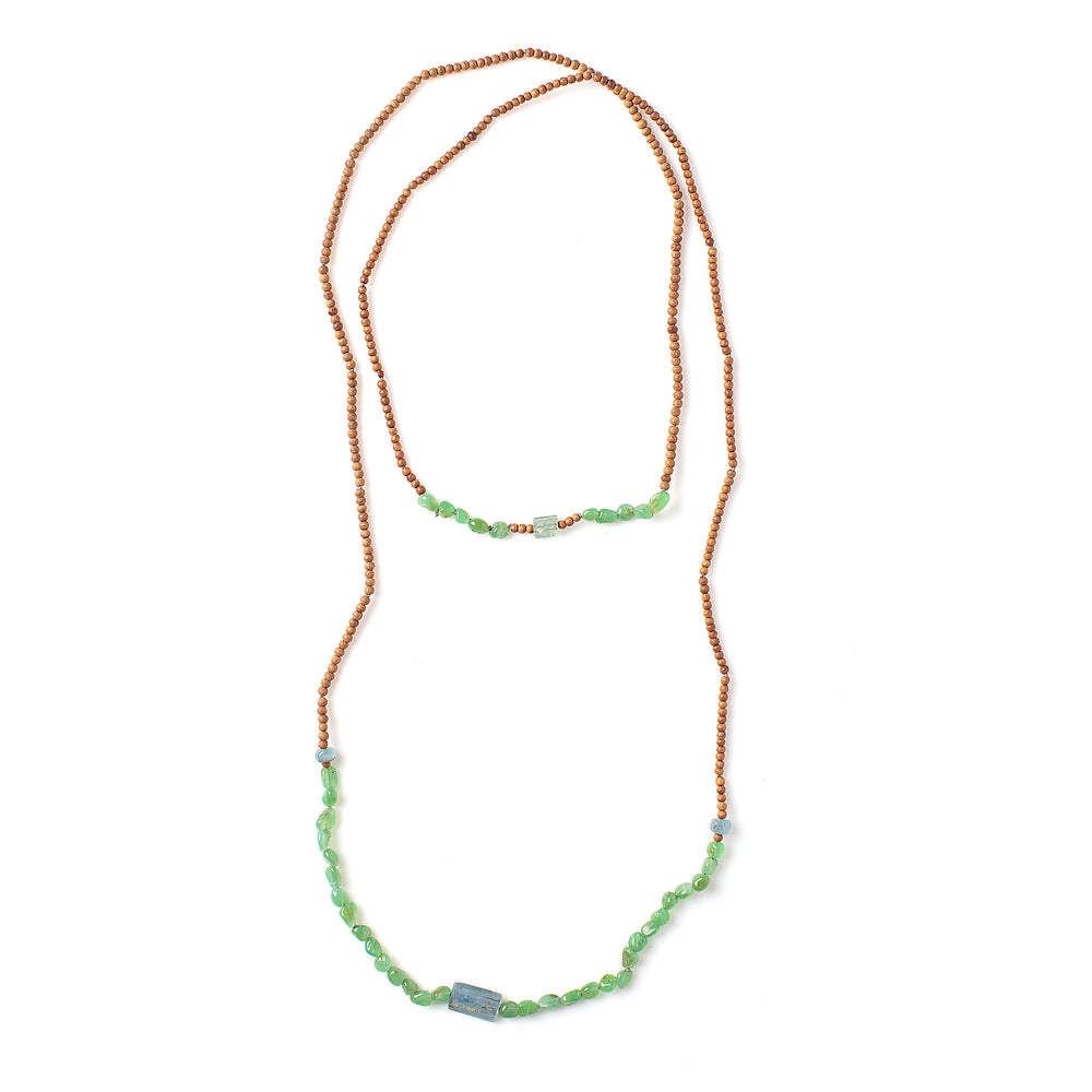
            
                Load image into Gallery viewer, Top-down view of Vacation Necklace with pebble green garnets
            
        
